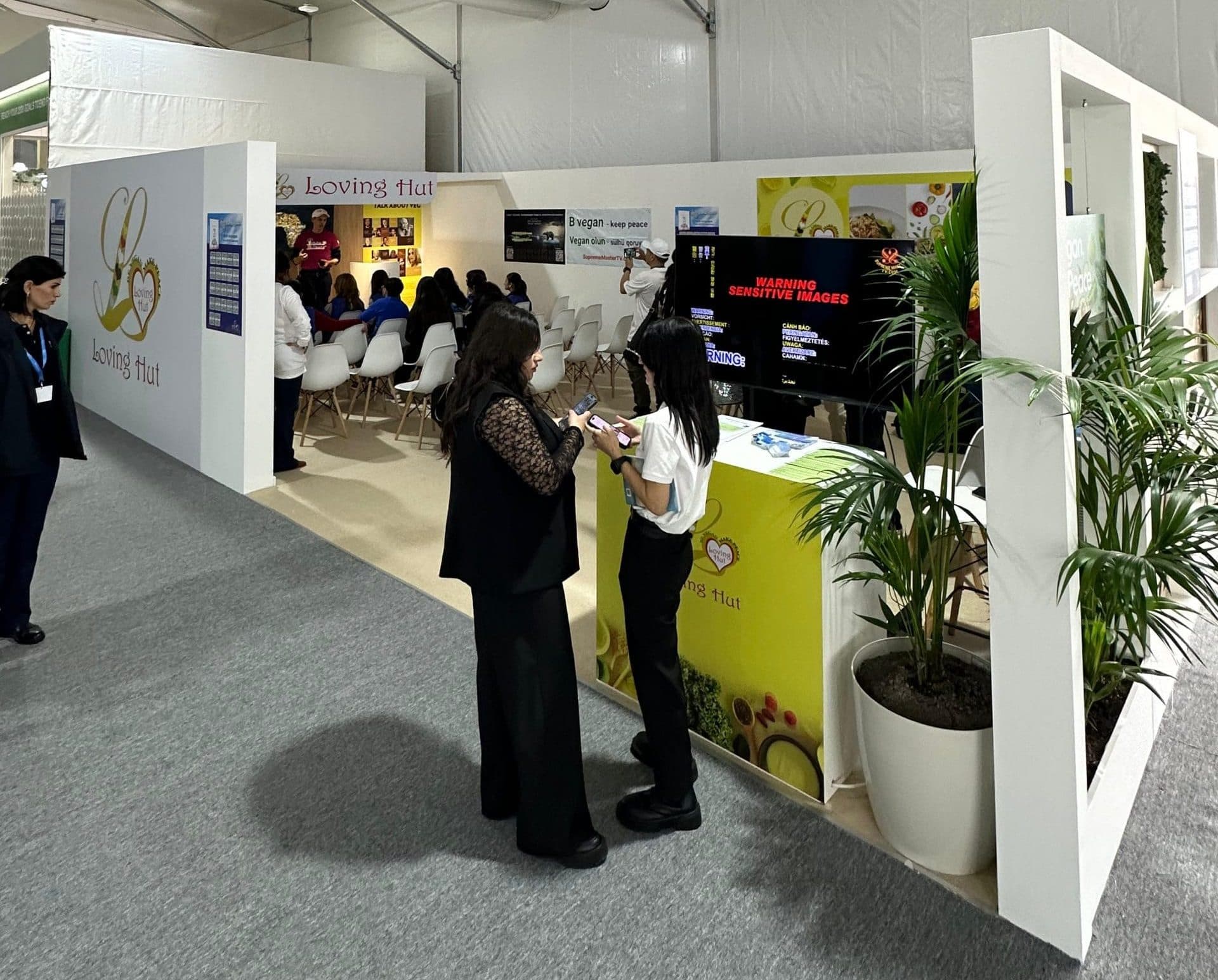 Loving Hut booth at COP29 2024, Baku